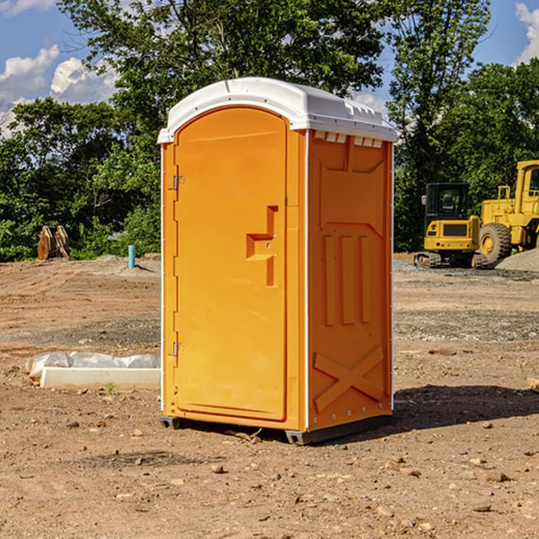 what is the cost difference between standard and deluxe portable toilet rentals in Neola